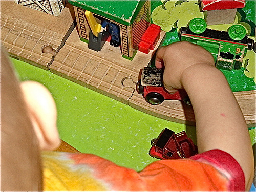 Boys and girls alike will love playing with wooden trains and tracks.